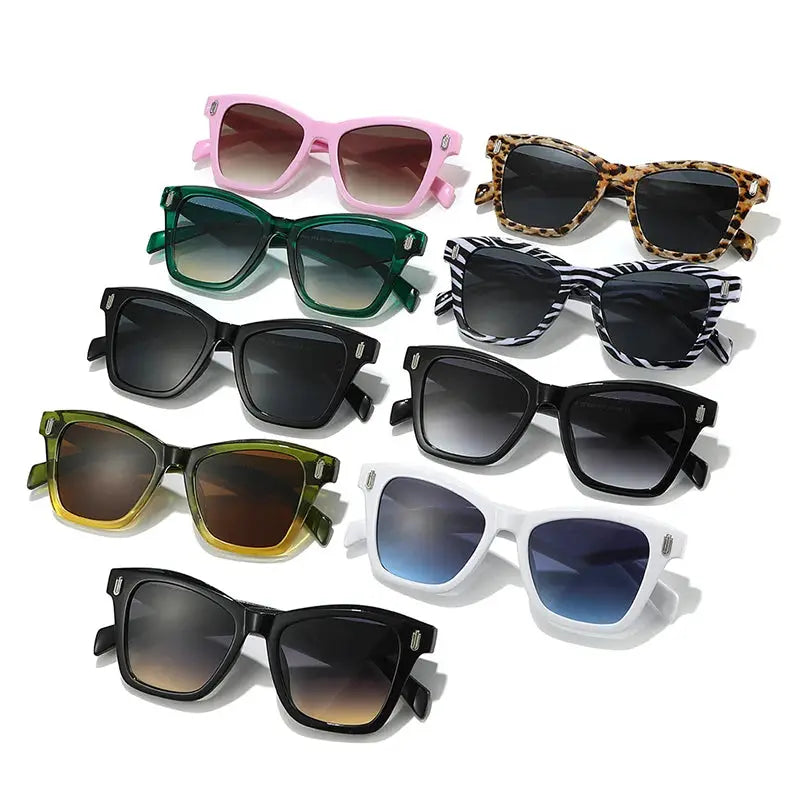 Eight cat-eye sunglasses in assorted frame colors with gradient lenses and retro rivet accents – Astroshadez