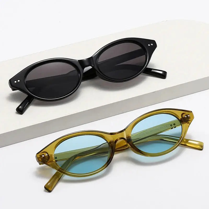 SHAUNA cat-eye sunglasses: black rivet-frame with dark lenses; amber frame with blue-green lenses – Astroshadez