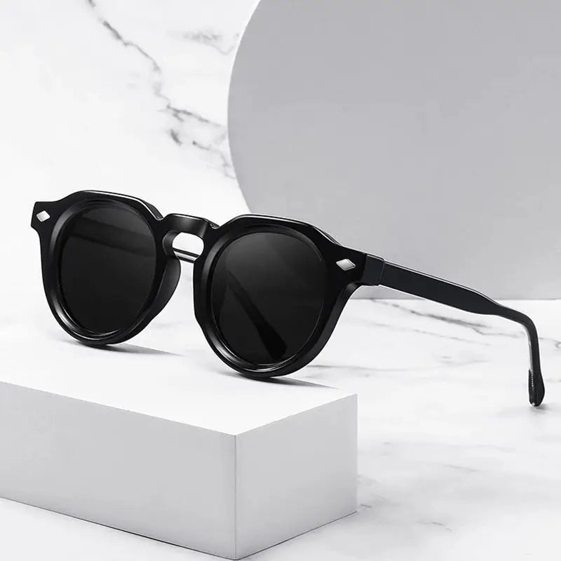 SHAUNA retro round sunglasses with black frame and dark lenses, rivet accents – Astroshadez
