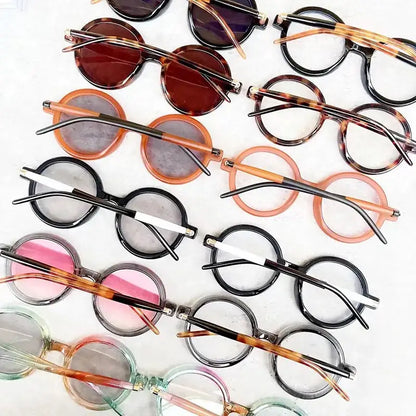 SHAUNA round sunglasses frames in assorted colors (black, tortoiseshell, pink, orange) arranged on a white background – Astroshadez