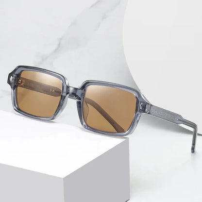 SHAUNA square sunglasses with translucent gray-blue frame and brown gradient lenses, retro rivets – Astroshadez