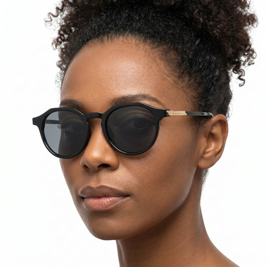 Nivara black round sunglasses with thick black frame, dark lenses, gold-tone temple accent – Astroshadez