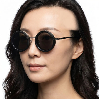 Quorion black round magnetic-clip polarized sunglasses with dark brown lenses, worn on face – Astroshadez