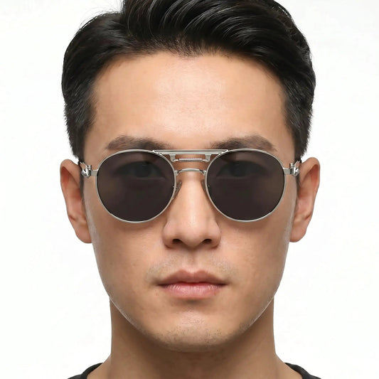 Aurex silver round metal-frame sunglasses with dark lenses worn by model – Astroshadez