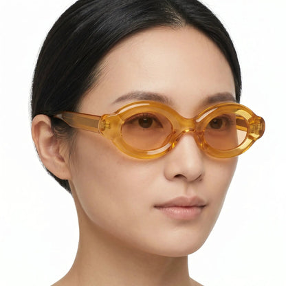 Elyndra translucent amber oval sunglasses with orange lenses – Astroshadez