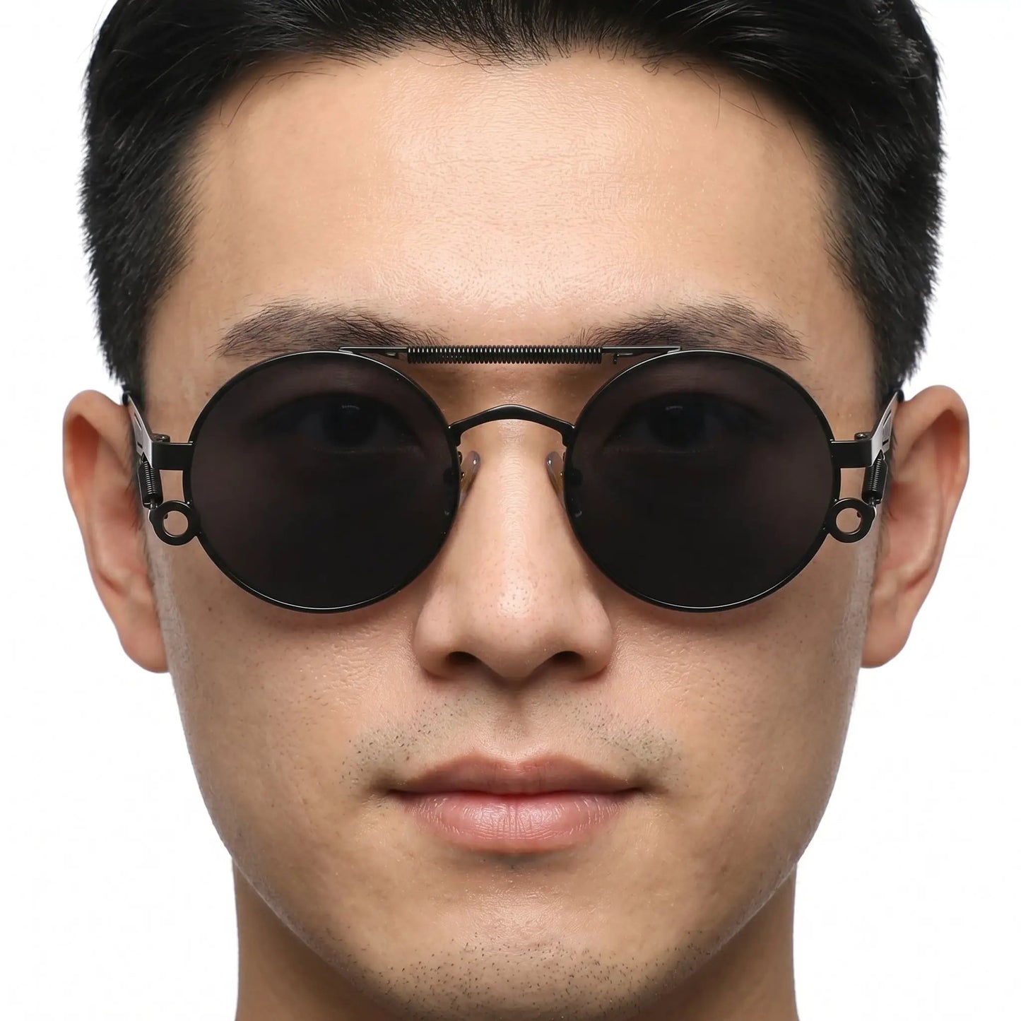 Noctis matte black metal round double-bridge sunglasses with dark lenses on a man's face – Astroshadez