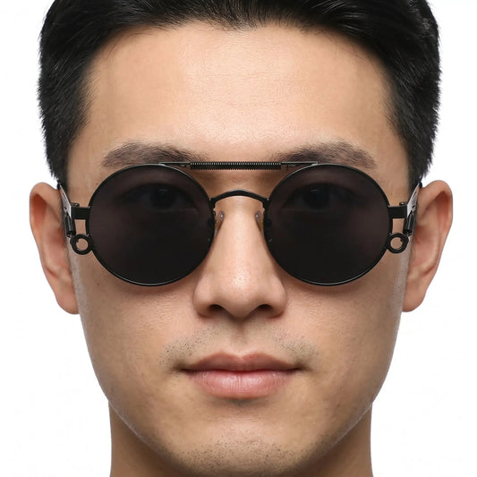 Noctis matte black metal round double-bridge sunglasses with dark lenses on a man's face – Astroshadez