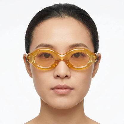 Elyndra translucent amber oval-lens sunglasses with amber frame and lenses – Astroshadez