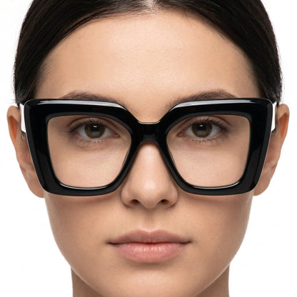 Velora glossy black oversized square sunglasses with dark lenses worn by a model – Astroshadez