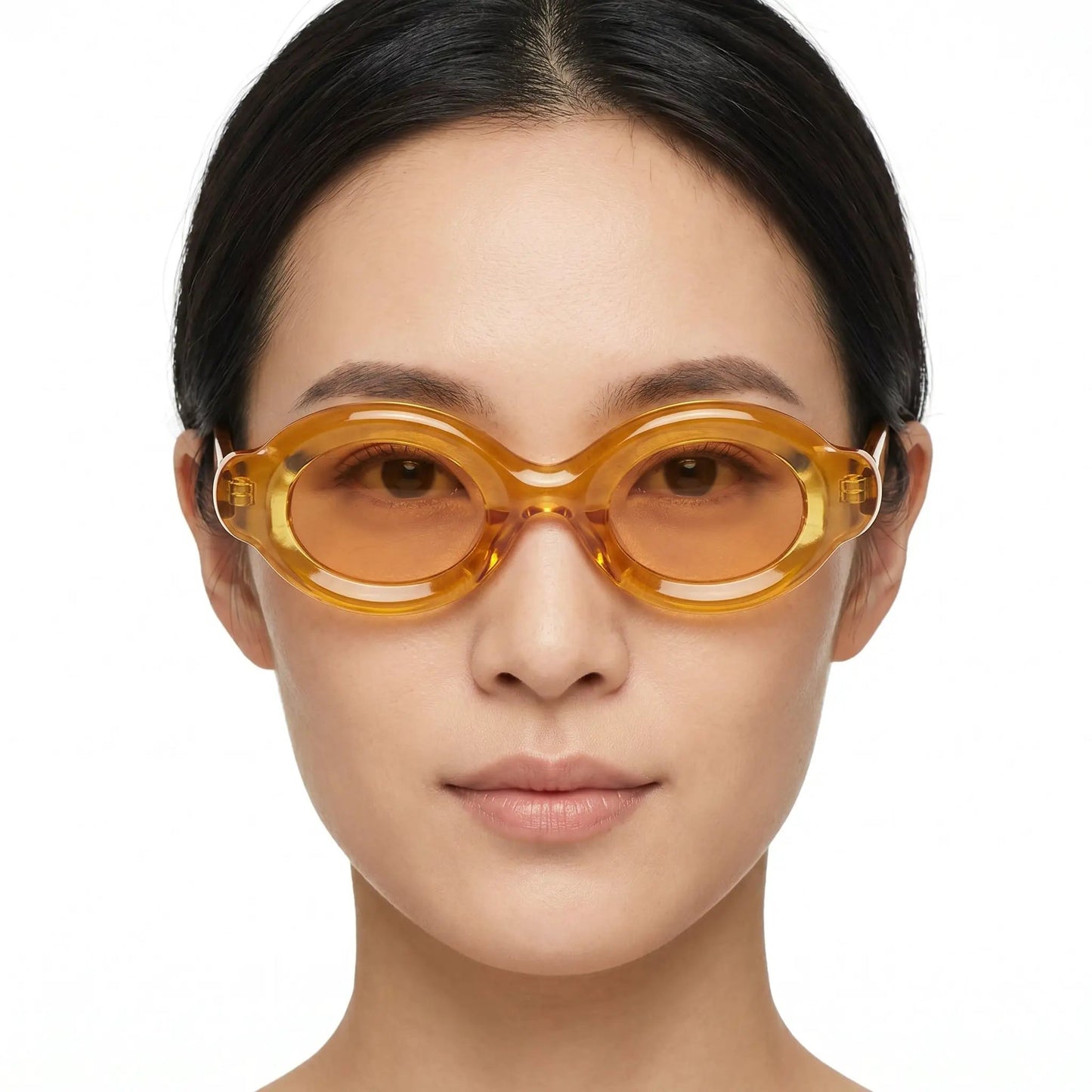 Elyndra Translucent Amber Oval Sunglasses with orange-tinted lenses and oversized rounded frames – Astroshadez