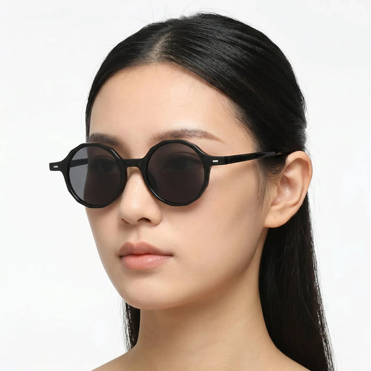 Astraeon black round sunglasses with dark UV400 lenses on model – Astroshadez