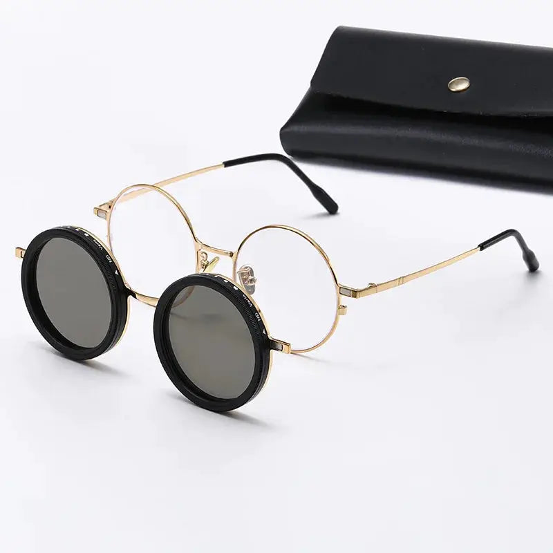 Round gold-tone metal sunglasses with black polarized clip-on lenses; includes a black case – Astroshadez