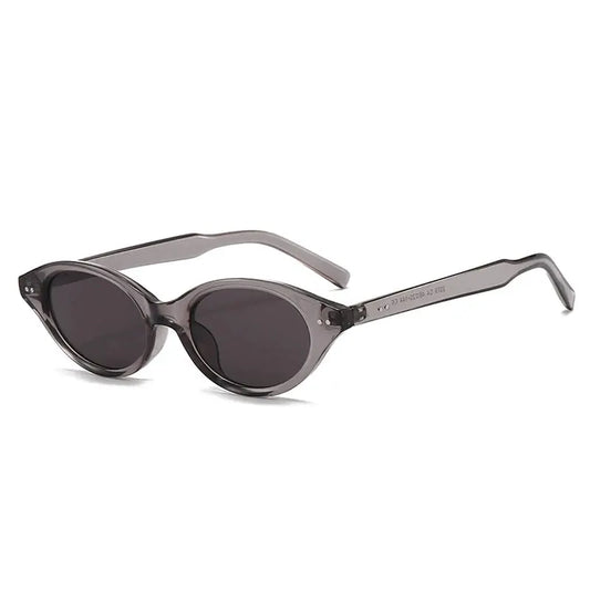 SHAUNA cat-eye sunglasses, translucent gray frame with dark oval lenses, rivet accents – Astroshadez